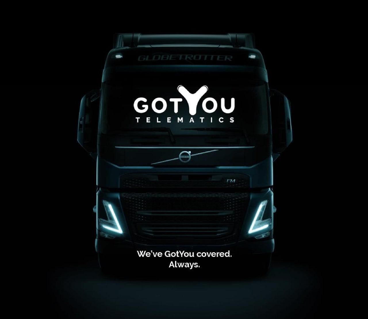 GotYou Telematics — front view of a black Volvo FH Globetrotter with the GotYou Telematics logo on the windshield, captioned "We've GotYou covered. Always."